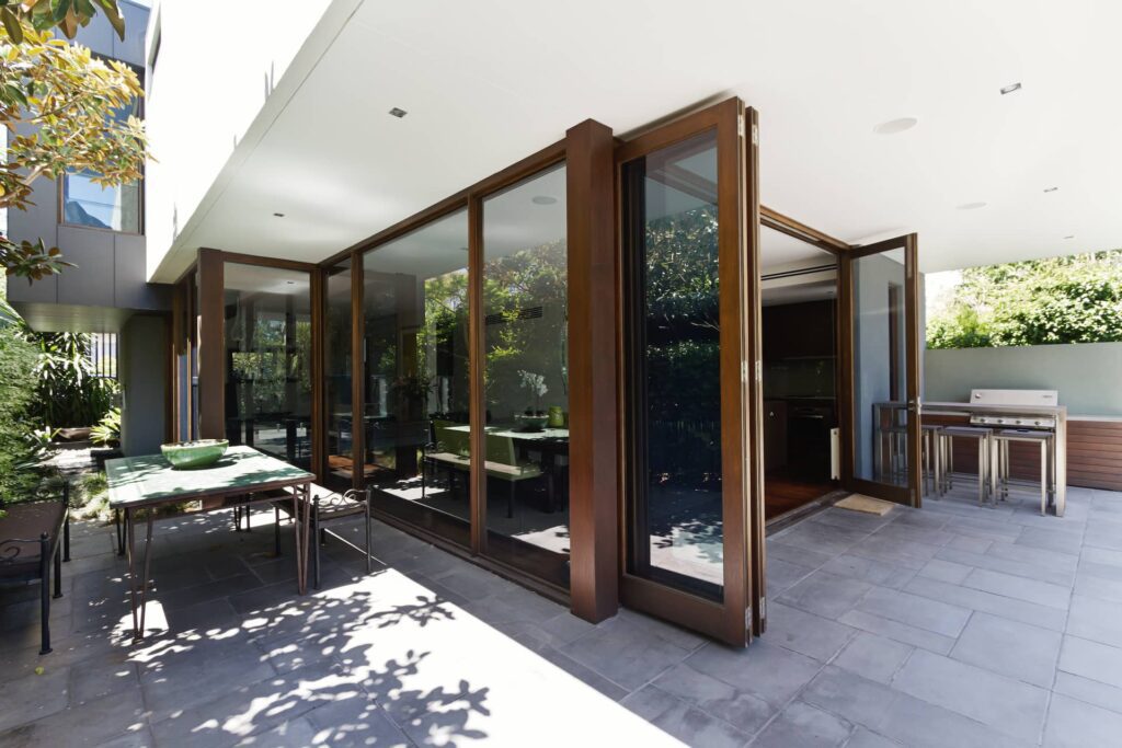 Retractable fly screen installed on bi-fold doors in a Sydney home 