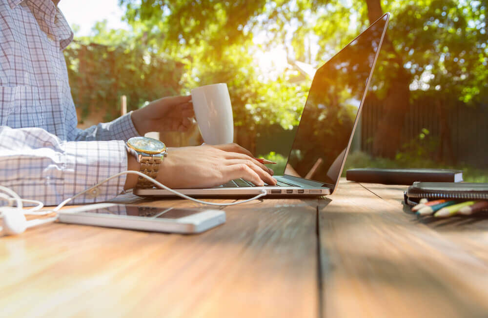 man is working in his trendy outdoor home office